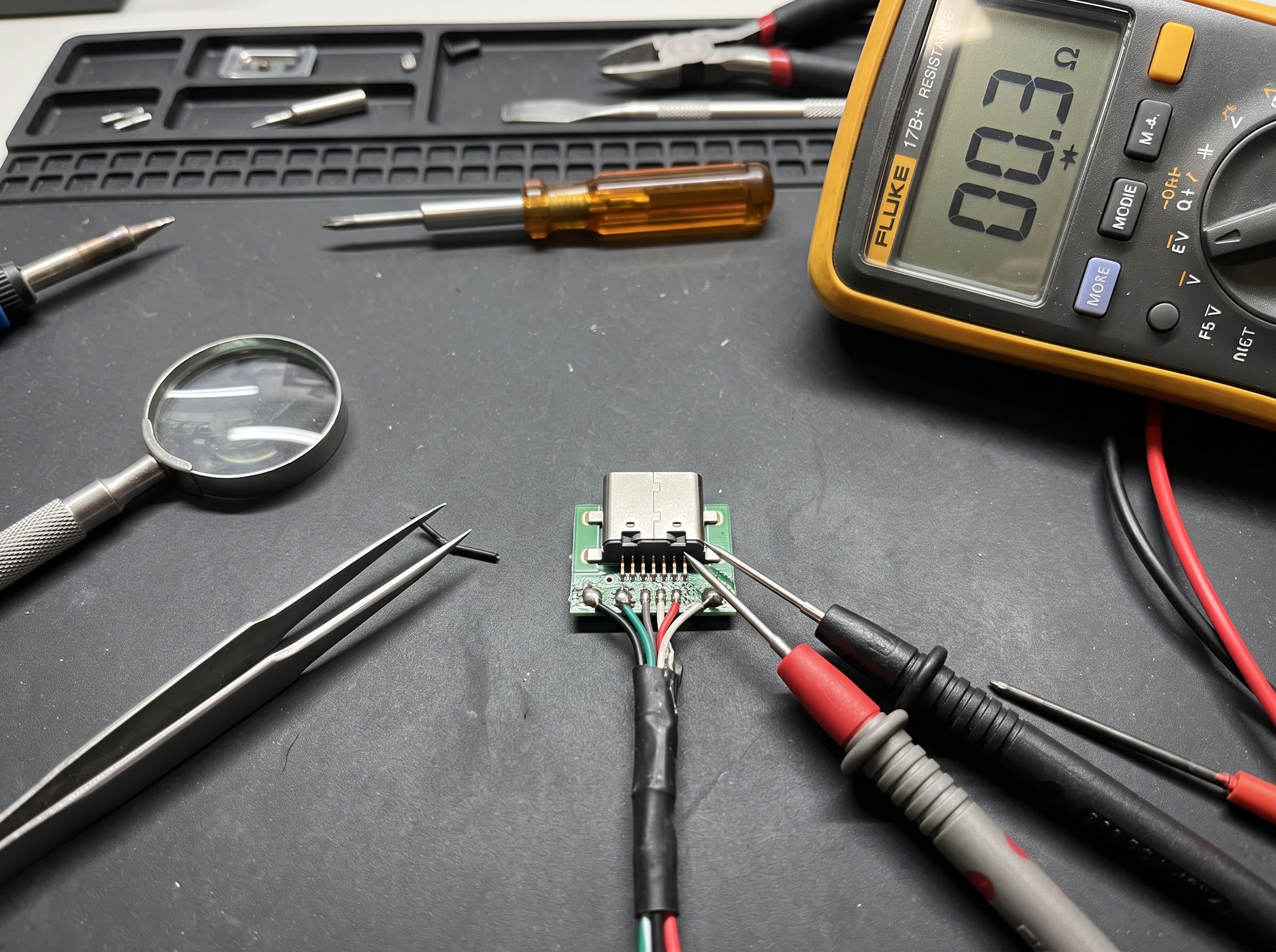 Continuity testing of individual conductor pins on a dental sensor USB connector with fine multimeter probes